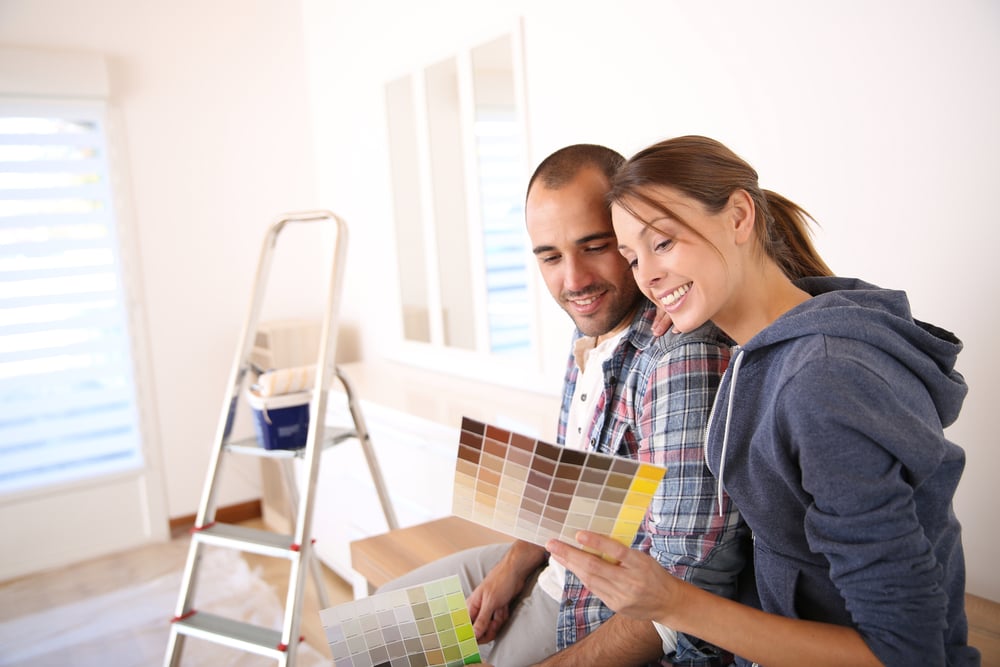 Couple in new house choosing color for walls-1