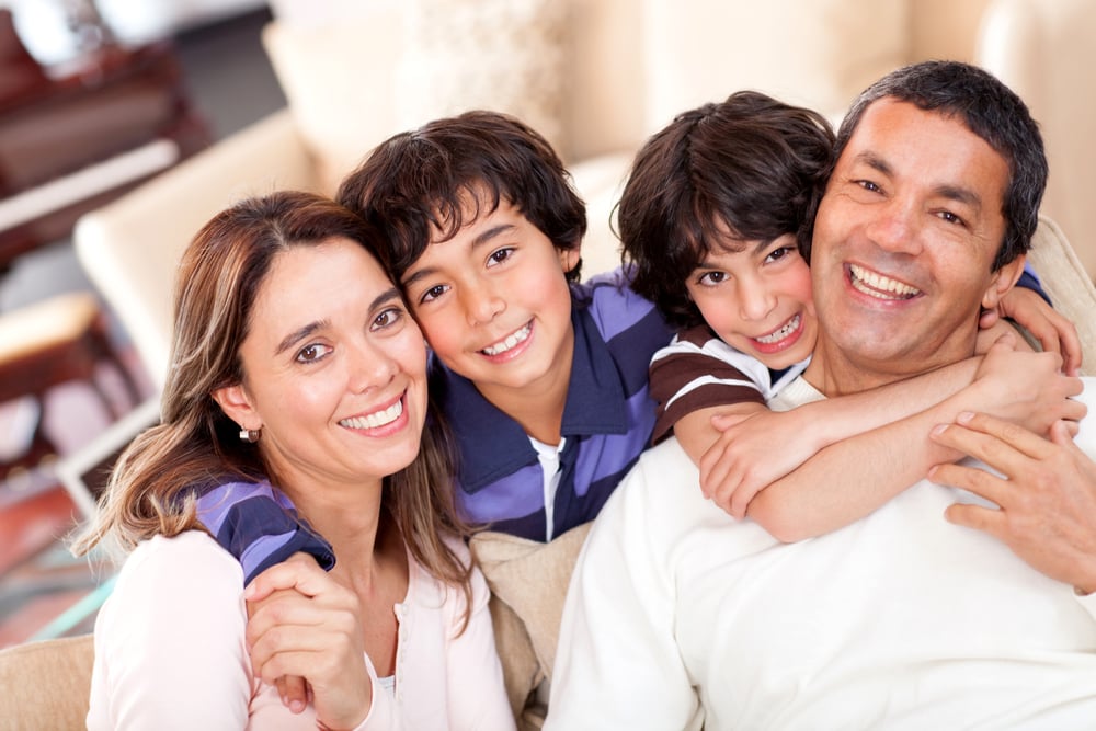 Portrait of a beautiful family smiling at home