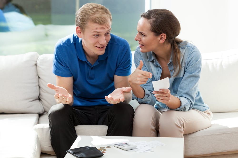 Portrait of young couple not having money